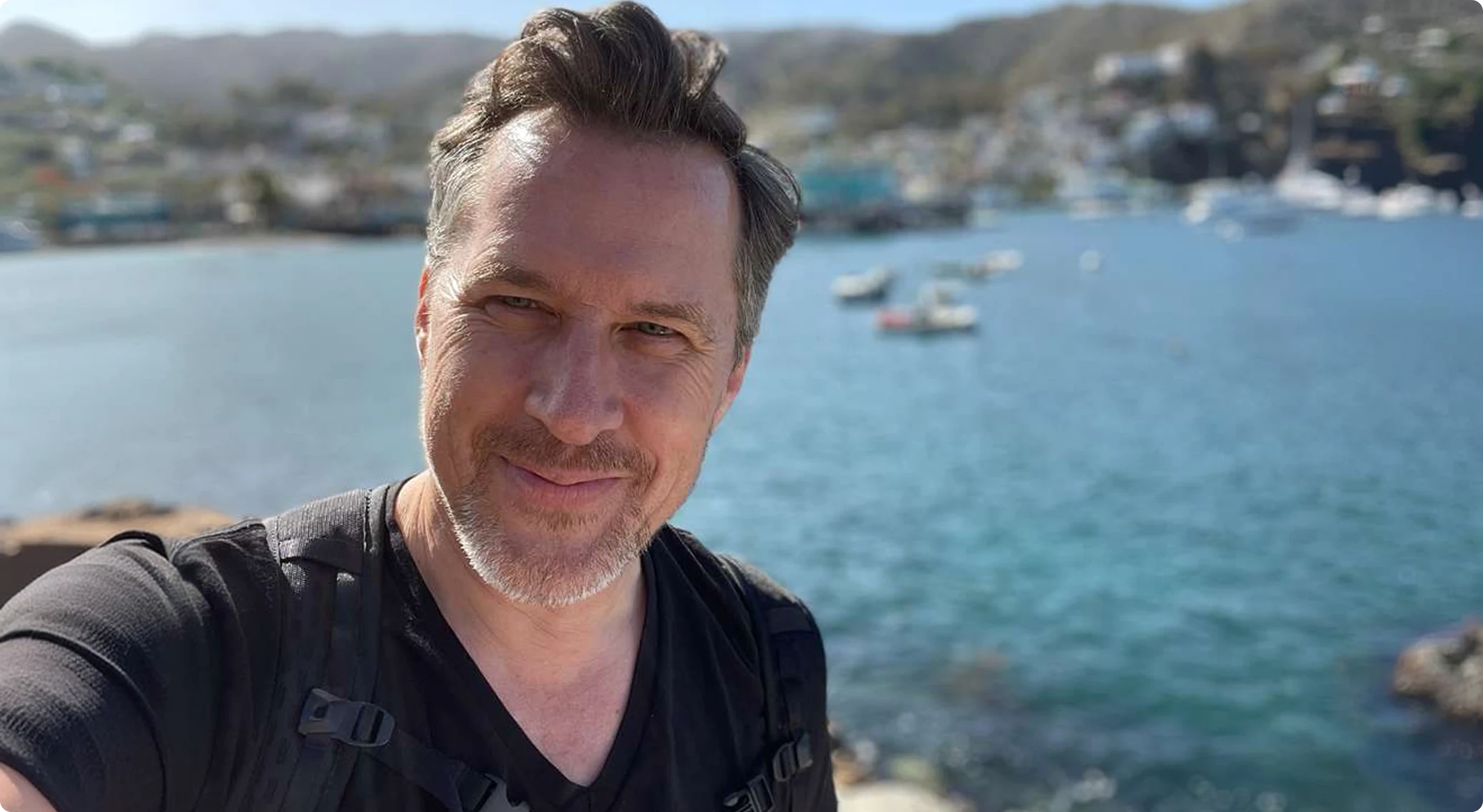 Danny O'Malley overlooking a harbor